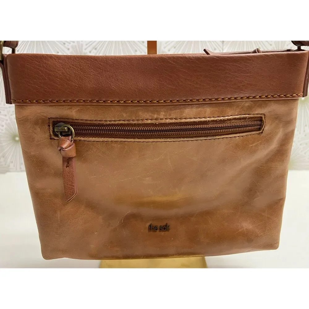 The Sak matte floral embossed tan leather Sanibel crossbody bag